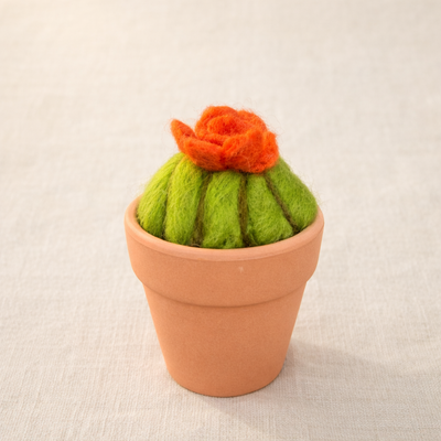 Needle felted cactus with orange flower in terracotta pot, displayed on neutral background