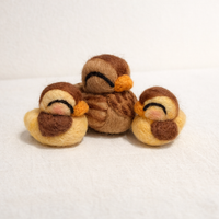 Needle felted hen with two ducklings showing wool texture