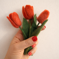 Close-up detail of needle felted wool tulip petals and stems