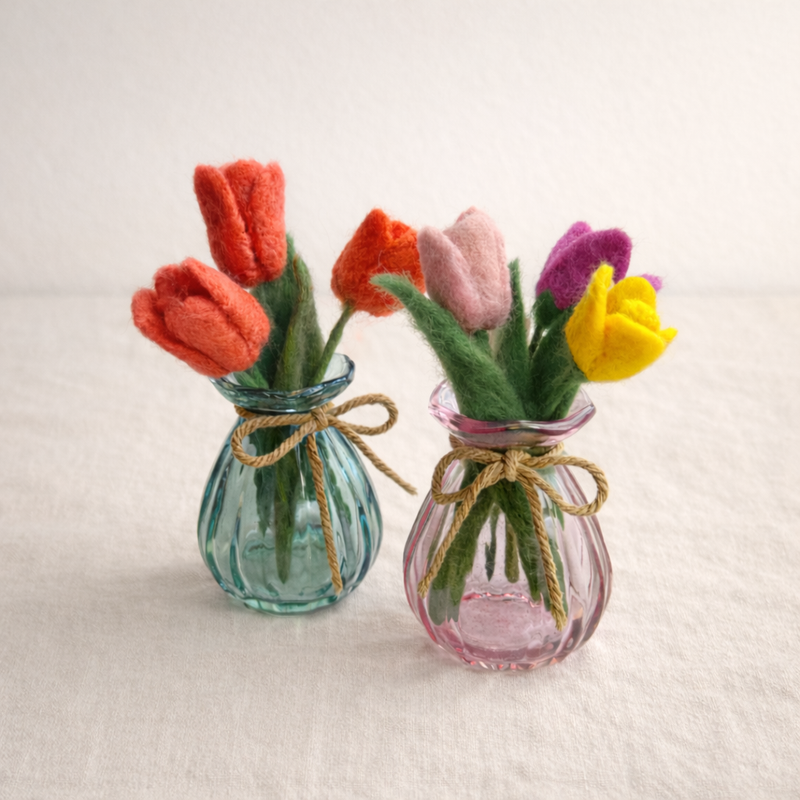 Needle felted wool tulip arrangement on warm cream background